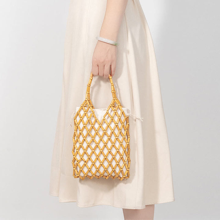 Borsa a mano con perline di legno cave intrecciate a mano in Buddha Stones