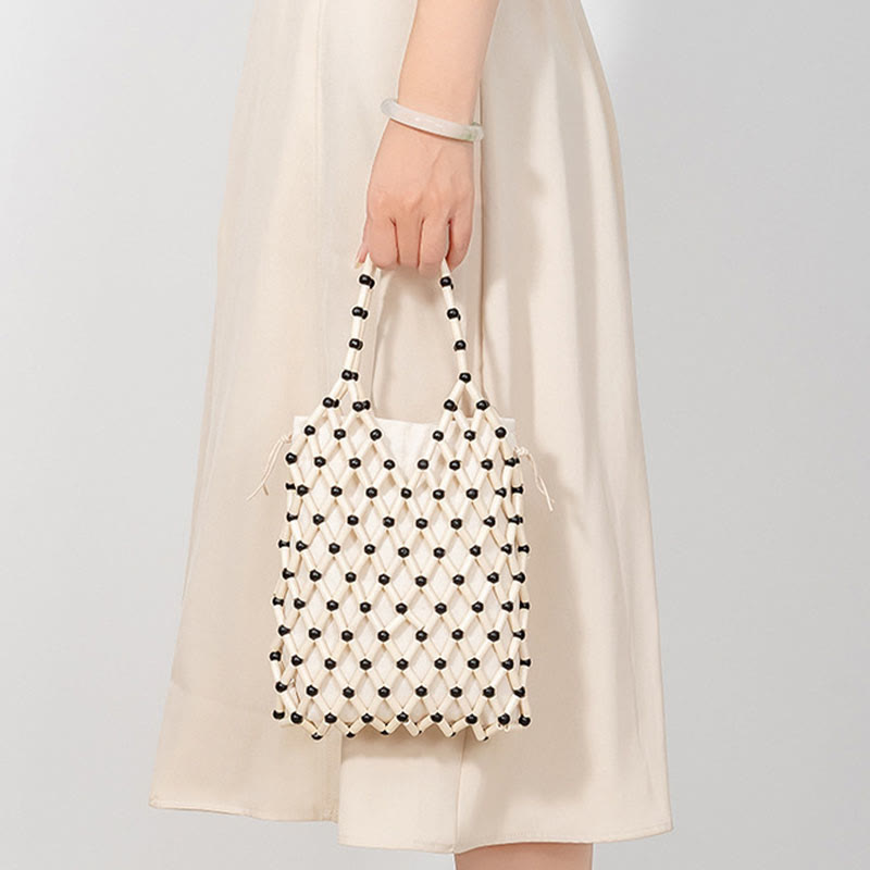 Borsa a mano con perline di legno cave intrecciate a mano in Buddha Stones