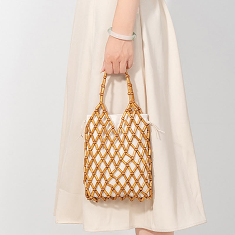 Borsa a mano con perline di legno cave intrecciate a mano in Buddha Stones