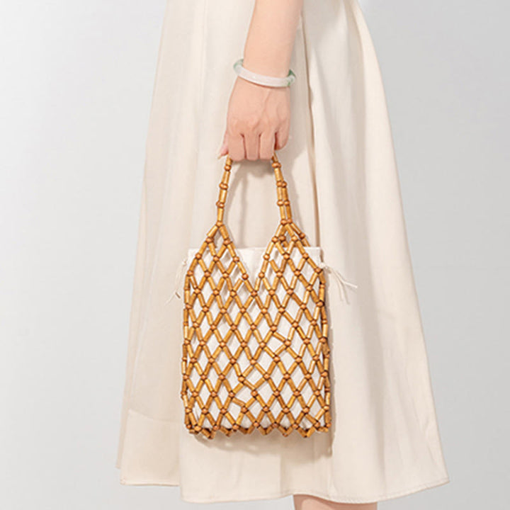 Borsa a mano con perline di legno cave intrecciate a mano in Buddha Stones