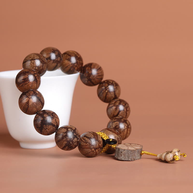Bracciale Buddha Stones Plum Blossom Wood per la pace interiore