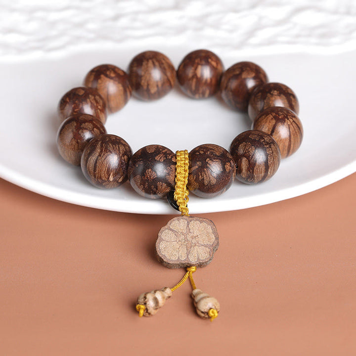 Bracciale Buddha Stones Plum Blossom Wood per la pace interiore
