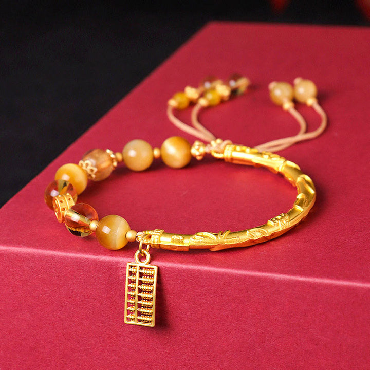 Braccialetto di protezione con ciondolo abaco in occhio di tigre naturale e citrino Buddha Stones