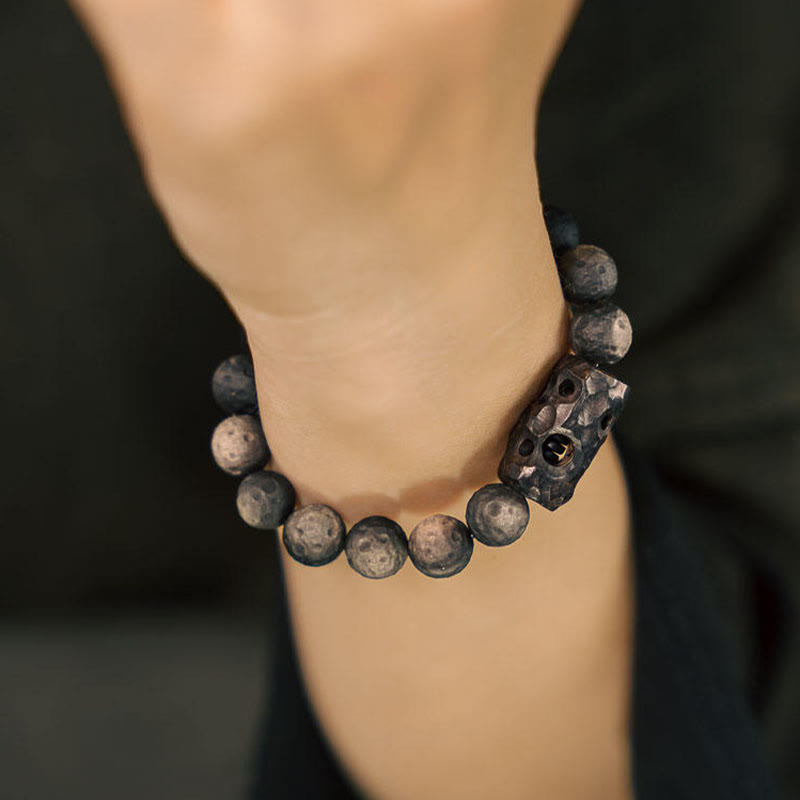 Braccialetto rilassante in legno di ebano e ossidiana con Buddha Stones in argento lucido