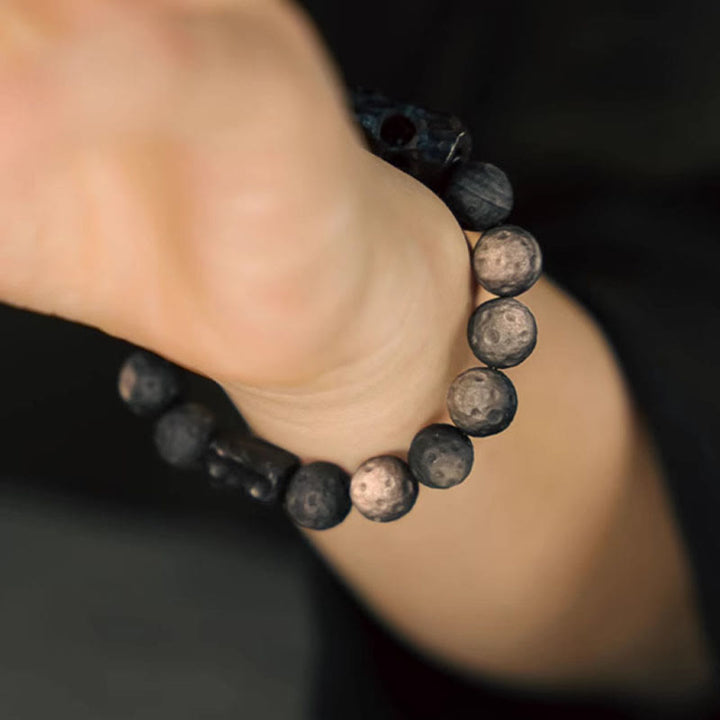 Braccialetto rilassante in legno di ebano e ossidiana con Buddha Stones in argento lucido