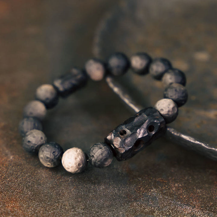 Braccialetto rilassante in legno di ebano e ossidiana con Buddha Stones in argento lucido