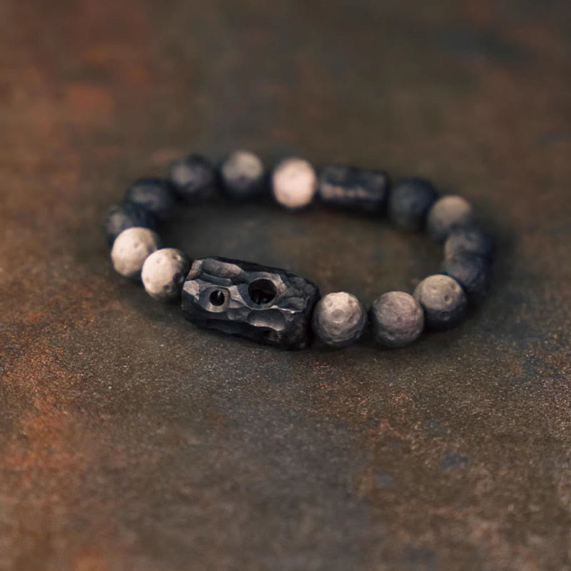 Braccialetto rilassante in legno di ebano e ossidiana con Buddha Stones in argento lucido