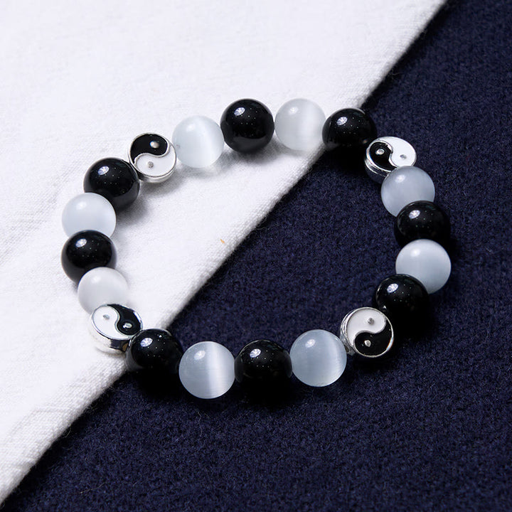 Braccialetto di forza purificatrice Yin Yang con occhio di gatto e ossidiana nera Buddha Stones