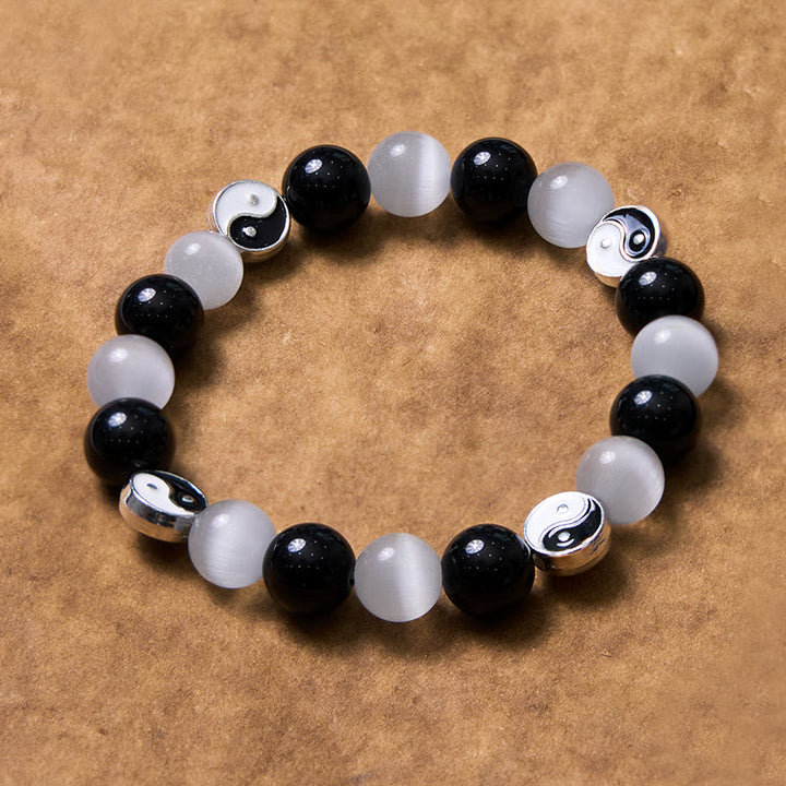 Braccialetto di forza purificatrice Yin Yang con occhio di gatto e ossidiana nera Buddha Stones