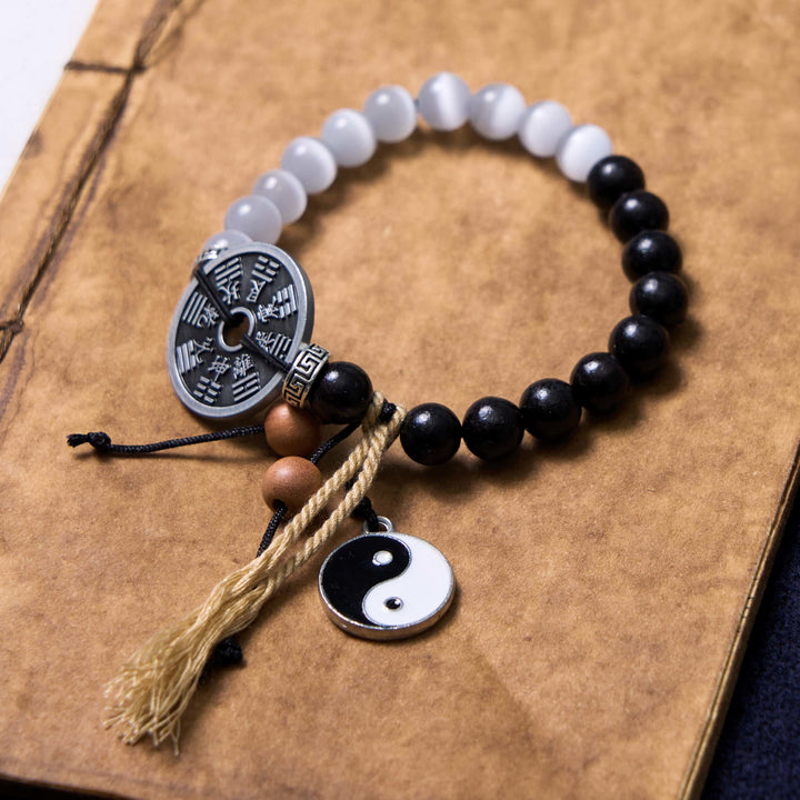 Braccialetto di corda di supporto per monete Bagua in legno di ebano con occhio di gatto Buddha Stones