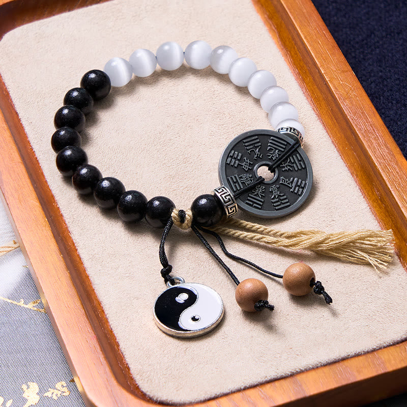 Braccialetto di corda di supporto per monete Bagua in legno di ebano con occhio di gatto Buddha Stones