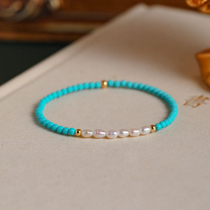 Braccialetto di protezione con piccole perle di agata rossa e turchese Buddha Stones