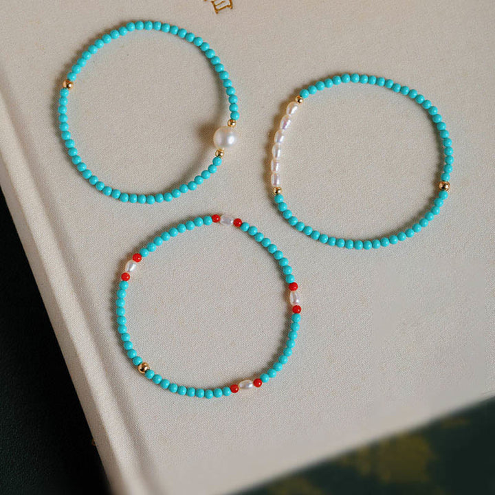 Braccialetto di protezione con piccole perle di agata rossa e turchese Buddha Stones