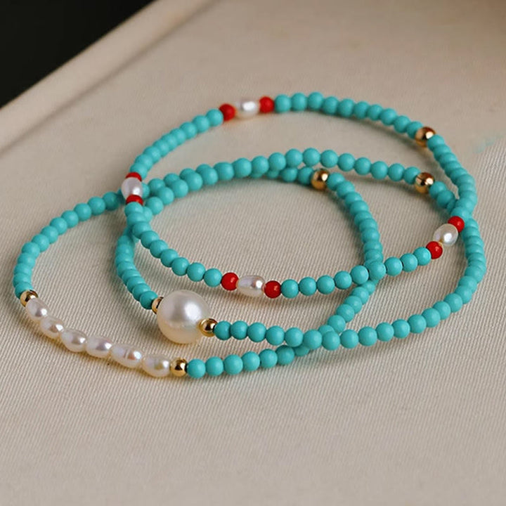 Braccialetto di protezione con piccole perle di agata rossa e turchese Buddha Stones