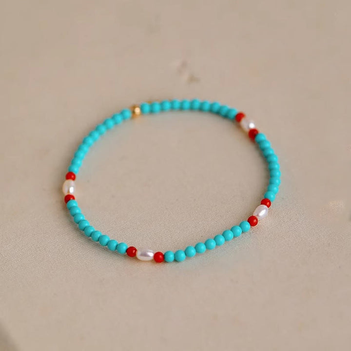 Braccialetto di protezione con piccole perle di agata rossa e turchese Buddha Stones