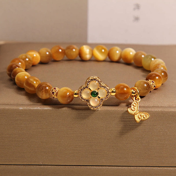Braccialetto di protezione con farfalla a quadrifoglio e occhio di tigre Buddha Stones