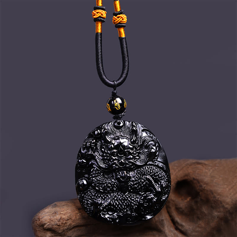 Collana con ciondolo di protezione in ossidiana nera naturale con drago intagliato rotondo in Buddha Stones - image 5