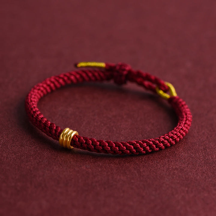 Braccialetto in corda intrecciata con design a triplo anello in oro 999 Buddha Stones - image 3