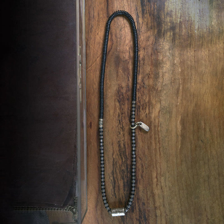 Braccialetto multistrato in rame con perline di legno di ebano tibetano e Buddha Stones