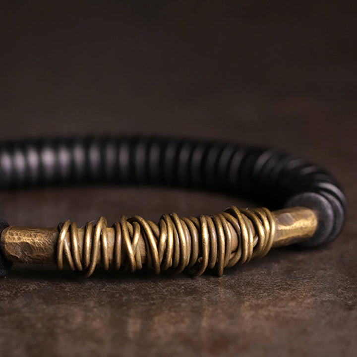 Braccialetto in legno di ebano tibetano calmo Buddha Stones Rame