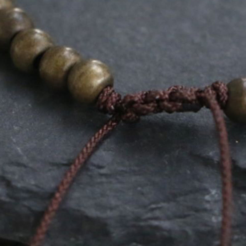 Bracciale semplice in ottone e rame con Buddha Stones, equilibrio e ricchezza
