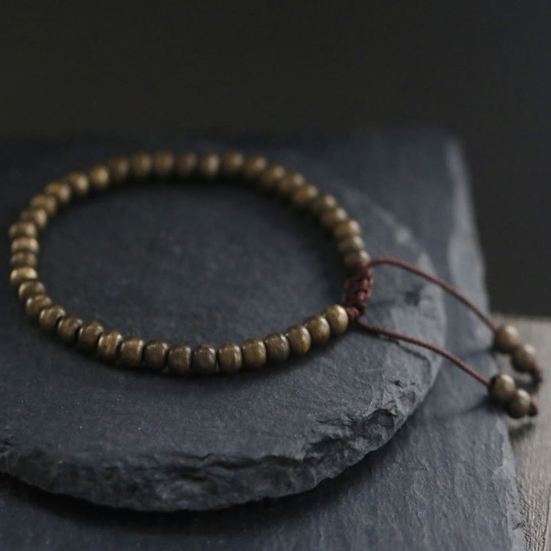 Bracciale semplice in ottone e rame con Buddha Stones, equilibrio e ricchezza