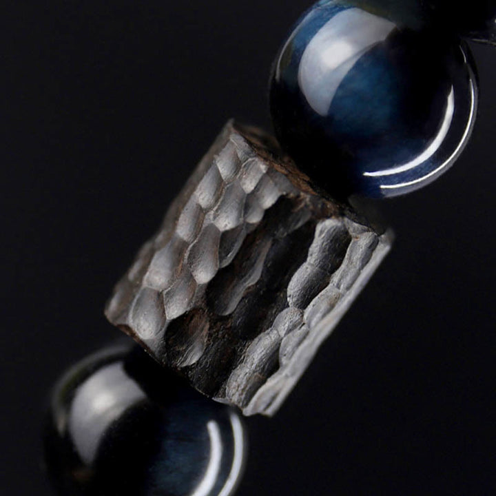 Braccialetto di perline di legno di ebano con occhio di tigre e Buddha Stones