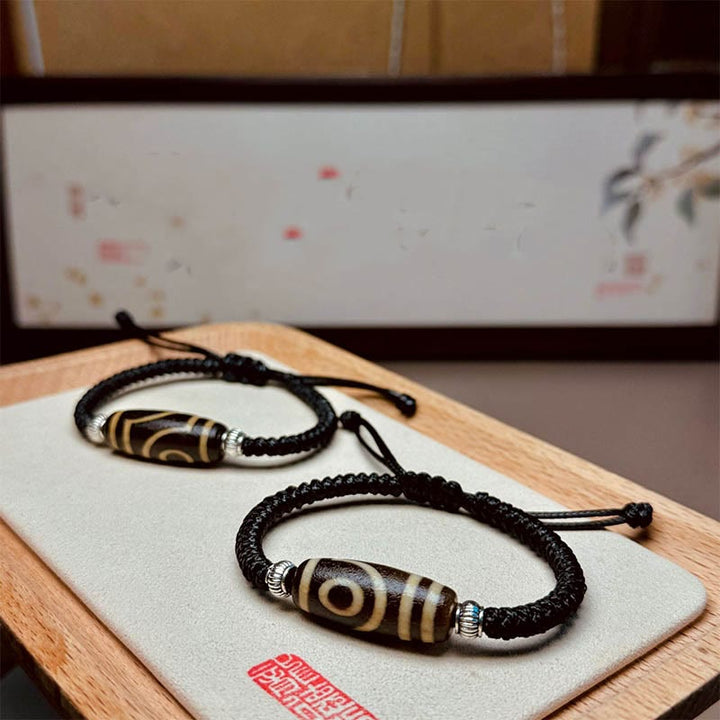 Buddha Stones Tibetano Perlina Dzi a nove occhi Perlina Dzi a tre occhi Braccialetto di corda di protezione della ricchezza
