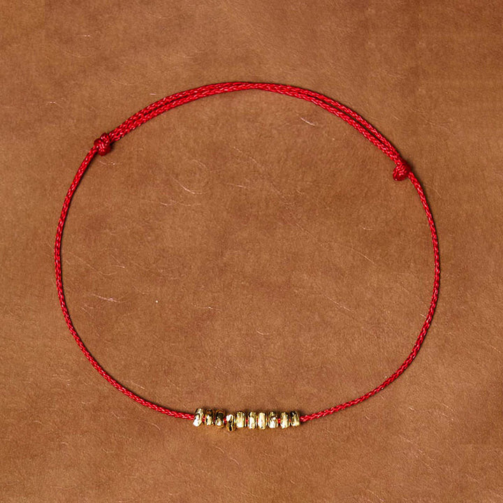 Braccialetto in corda ultra sottile intrecciata con piccoli pezzi di protezione in argento sterling 925 fatto a mano Buddha Stones - Corda oro-rossa (circonferenza polso 14-20 cm) - image 0