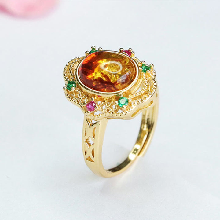 Anello di fiducia in Buddha Stones con fiore di ambra cava in pizzo
