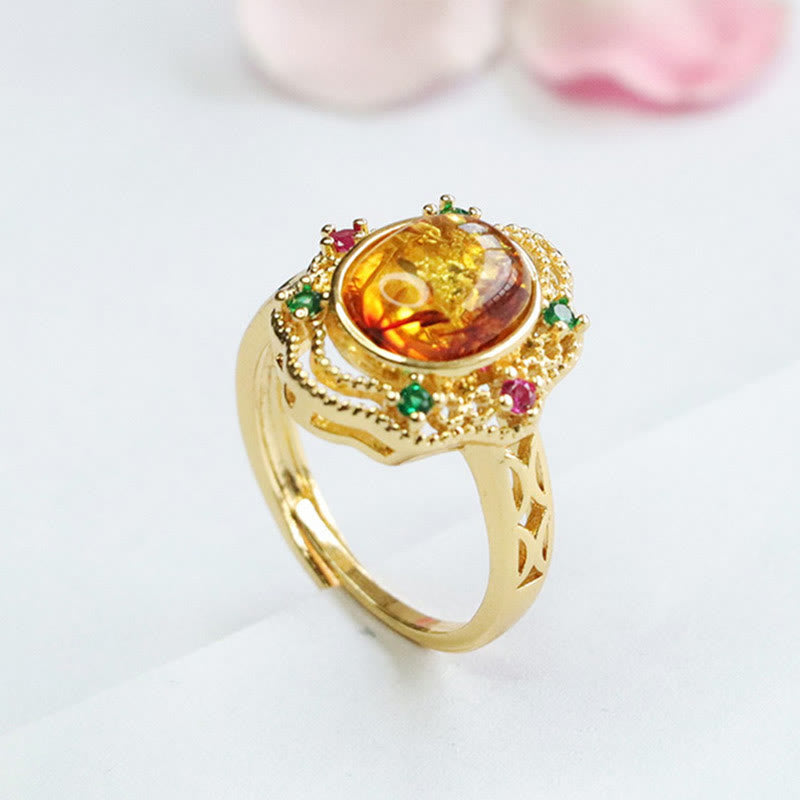 Anello di fiducia in Buddha Stones con fiore di ambra cava in pizzo