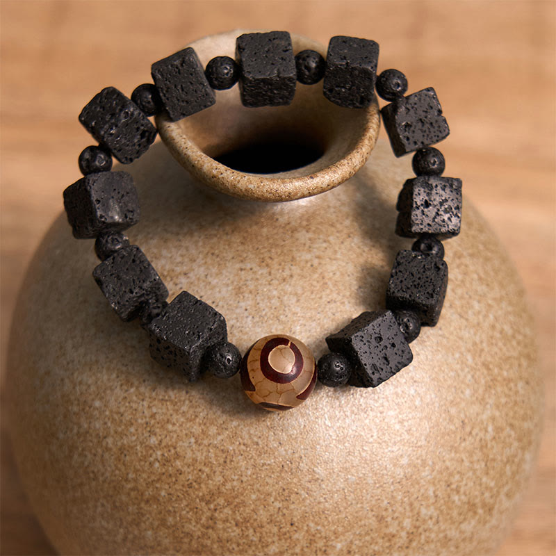 Braccialetto di guarigione con perline di Dzi e pietra lavica Buddha Stones