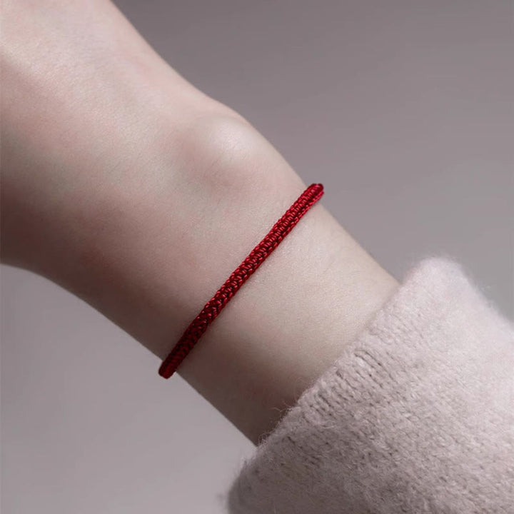 Braccialetto di collegamento in giada con filo rosso Buddha Stones