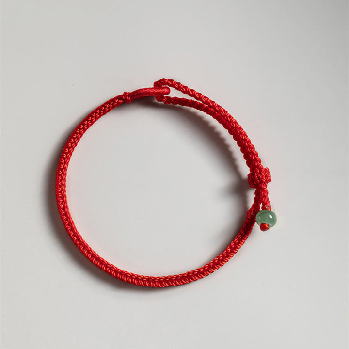 Braccialetto di collegamento in giada con filo rosso Buddha Stones