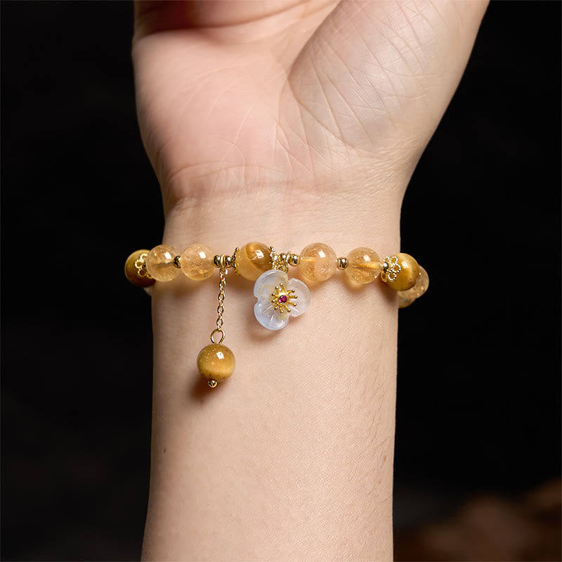 Braccialetto di generosità con ciondolo a forma di fiore con occhio di tigre e citrino Buddha Stones
