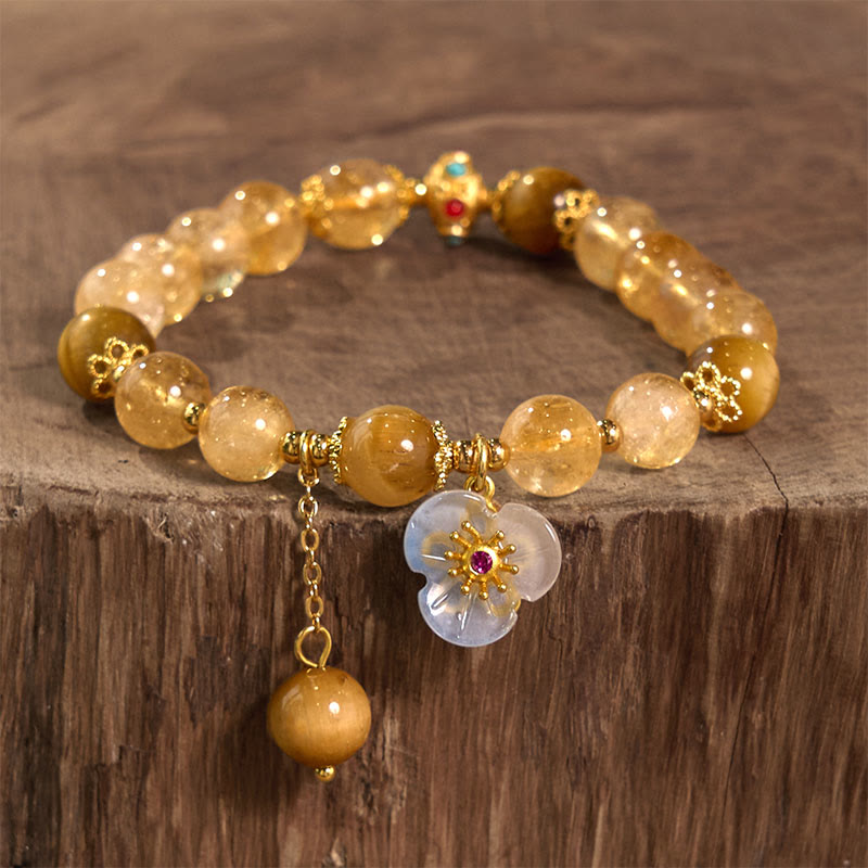 Braccialetto di generosità con ciondolo a forma di fiore con occhio di tigre e citrino Buddha Stones