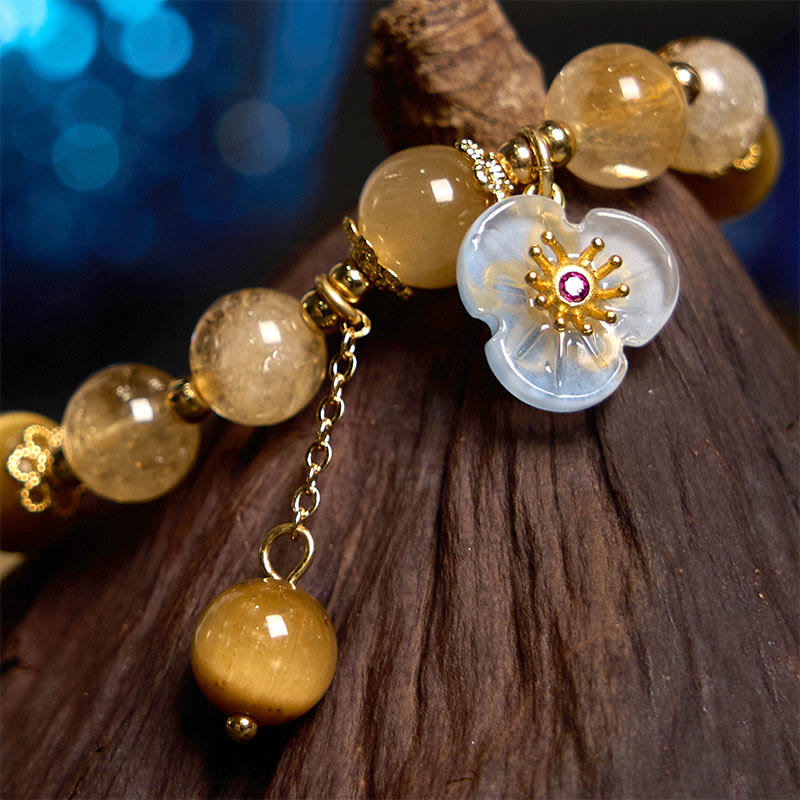 Braccialetto di generosità con ciondolo a forma di fiore con occhio di tigre e citrino Buddha Stones
