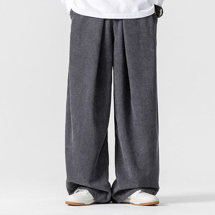 Pantaloni da uomo a gamba larga in velluto a coste tinta unita con motivo Buddha Stones e tasche - image 1