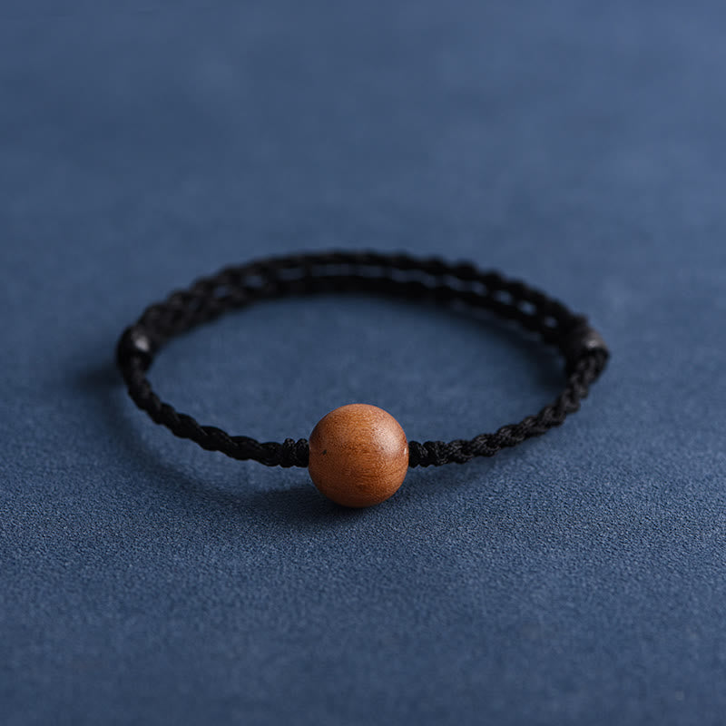 Bracciale intrecciato con perline di legno di pesca naturale Buddha Stones che allontanano gli spiriti maligni