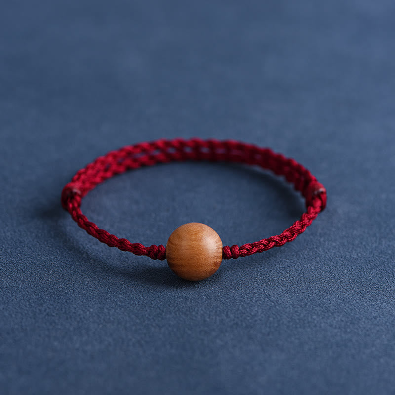 Bracciale intrecciato con perline di legno di pesca naturale Buddha Stones che allontanano gli spiriti maligni