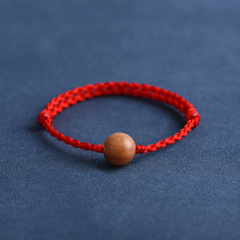 Bracciale intrecciato con perline di legno di pesca naturale Buddha Stones che allontanano gli spiriti maligni