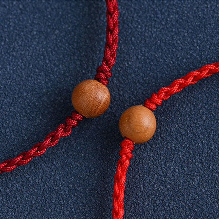 Bracciale intrecciato con perline di legno di pesca naturale Buddha Stones che allontanano gli spiriti maligni
