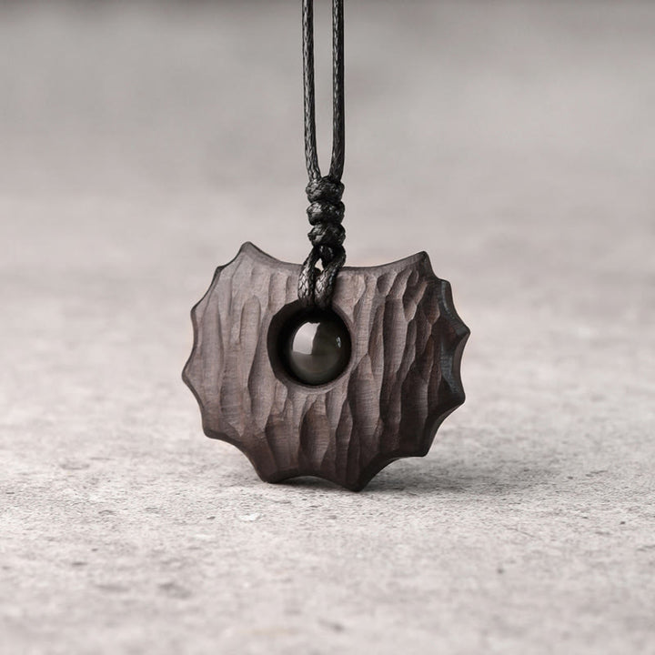 Collana pendente Buddha Stones in legno di ebano e ossidiana di forma irregolare, pace e calma