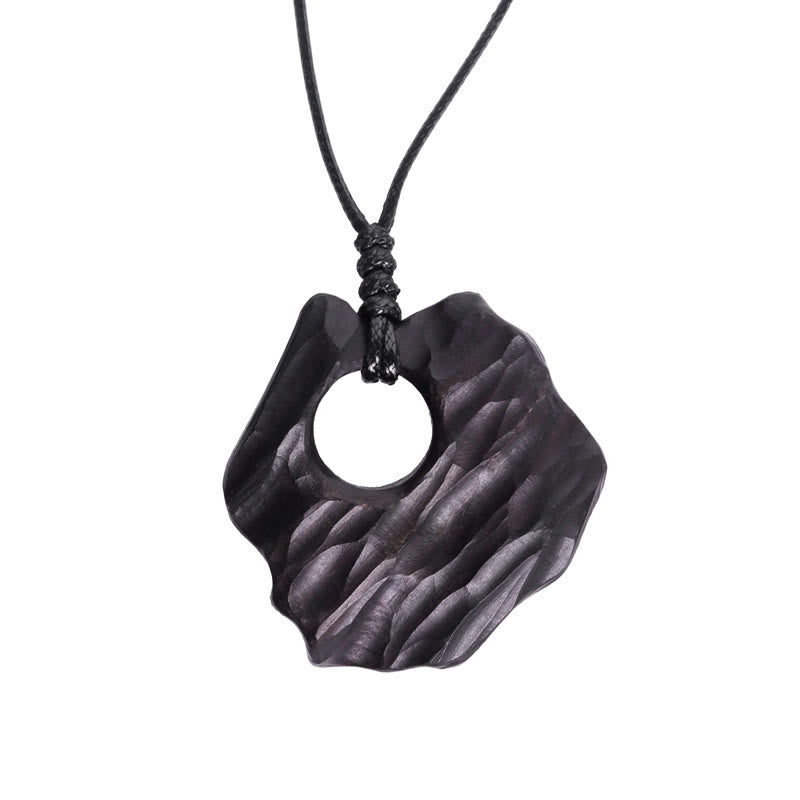 Collana pendente con ciondolo in legno di ebano e forma irregolare cava in Buddha Stones , equilibrio della pace