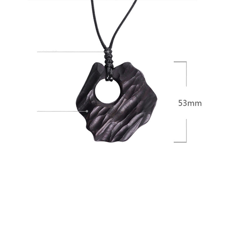 Collana pendente con ciondolo in legno di ebano e forma irregolare cava in Buddha Stones , equilibrio della pace