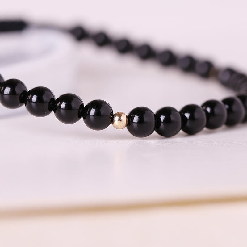 Braccialetto di corda di realizzazione con piccole perle di ossidiana nera Buddha Stones