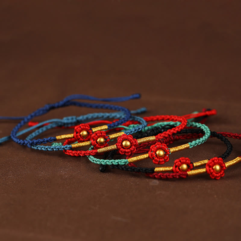 Braccialetto di corda di protezione della fortuna con design a fiori fatto a mano con perline in oro 999 Buddha Stones - image 1