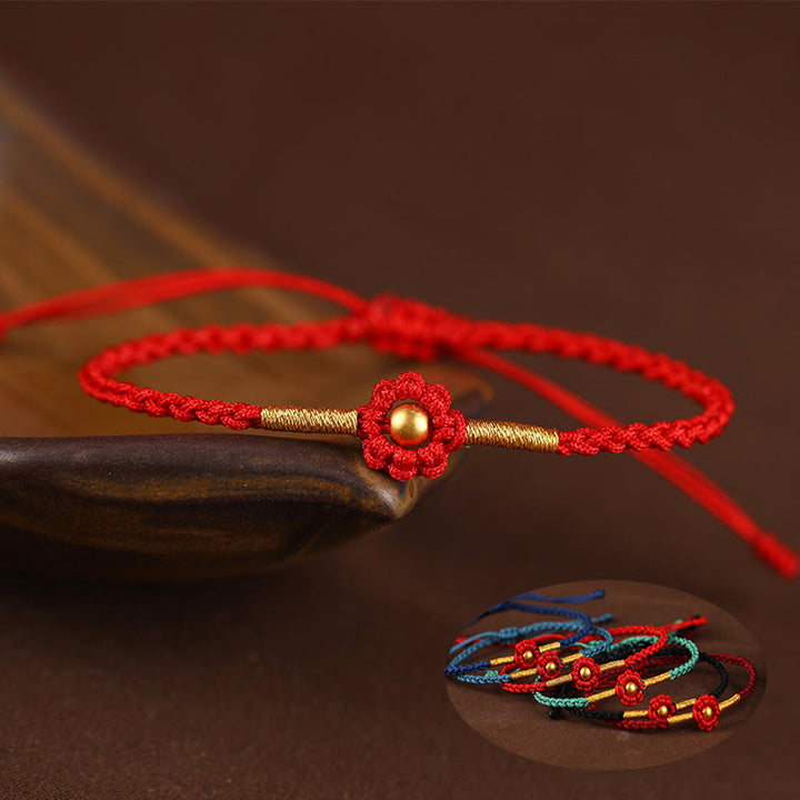 Braccialetto di corda di protezione della fortuna con design a fiori fatto a mano con perline in oro 999 Buddha Stones - image 0