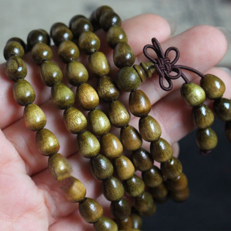 Braccialetto di protezione in legno naturale Phoebe Zhennan con 108 perle a goccia Mala Buddha Stones