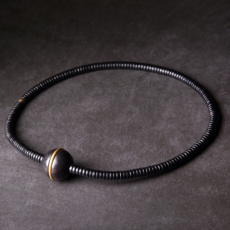 Collana con bracciale a doppio giro in Buddha Stones, in legno di ebano, in ottone e rame, con sfera di equilibrio cubica